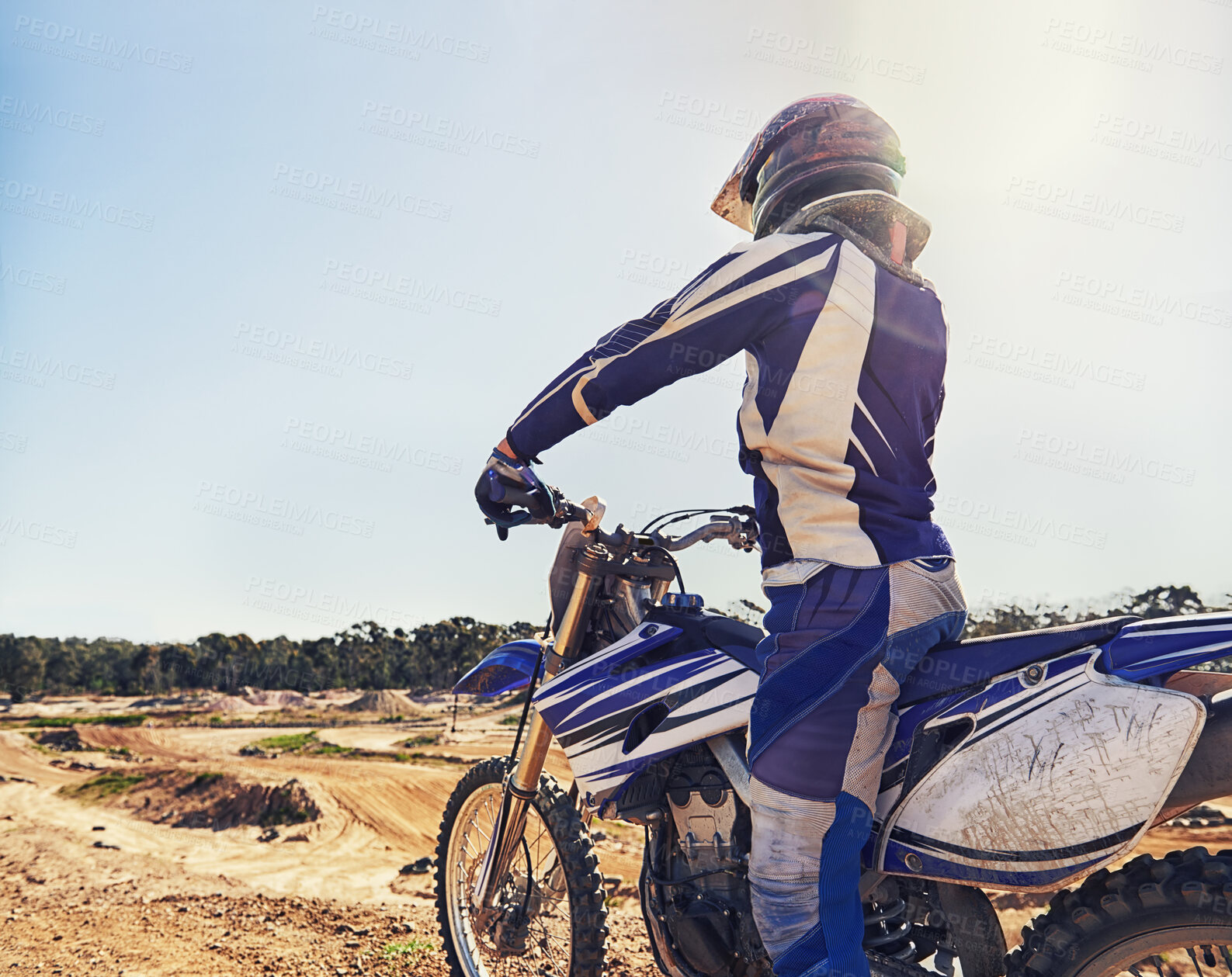 Buy stock photo Motorbike, sports and danger with back view of biker person outdoor, sunl with uniform for riding on dirt track. Speed, power and risk with motorcycle, transportation and adventure for adrenaline