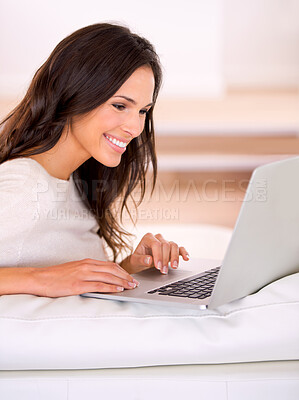 Buy stock photo Woman, smile and laptop on couch at home, living room and apartment for remote work, virtual job and creative career. Female person, freelancer or writer for online publication, blog or email