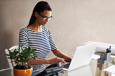 Buy stock photo Computer, planning and business woman at office desk for online project, typing and graphic design at creative startup. Worker, designer or editor in glasses on laptop for research on wall background