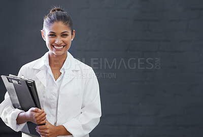 Buy stock photo Cropped shot of a smiling young medical professional