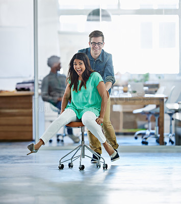 Buy stock photo Startup, celebration or business women push chair for happiness, investment growth or office success in company workspace. Diversity, fun and people with excited face for playing, achievement and win