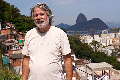 Buy stock photo Buildings, portrait and man by city background with poverty for location, sky and developing country. Poor neighborhood, male person and housing problem with urban inequality and favela in Brazil