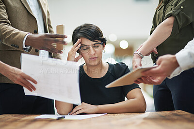 Buy stock photo Business woman, headache and colleagues with documents for feedback, crisis or burnout in office. Female person, stress or migraine with papers in chaos for teamwork, mentorship or leadership