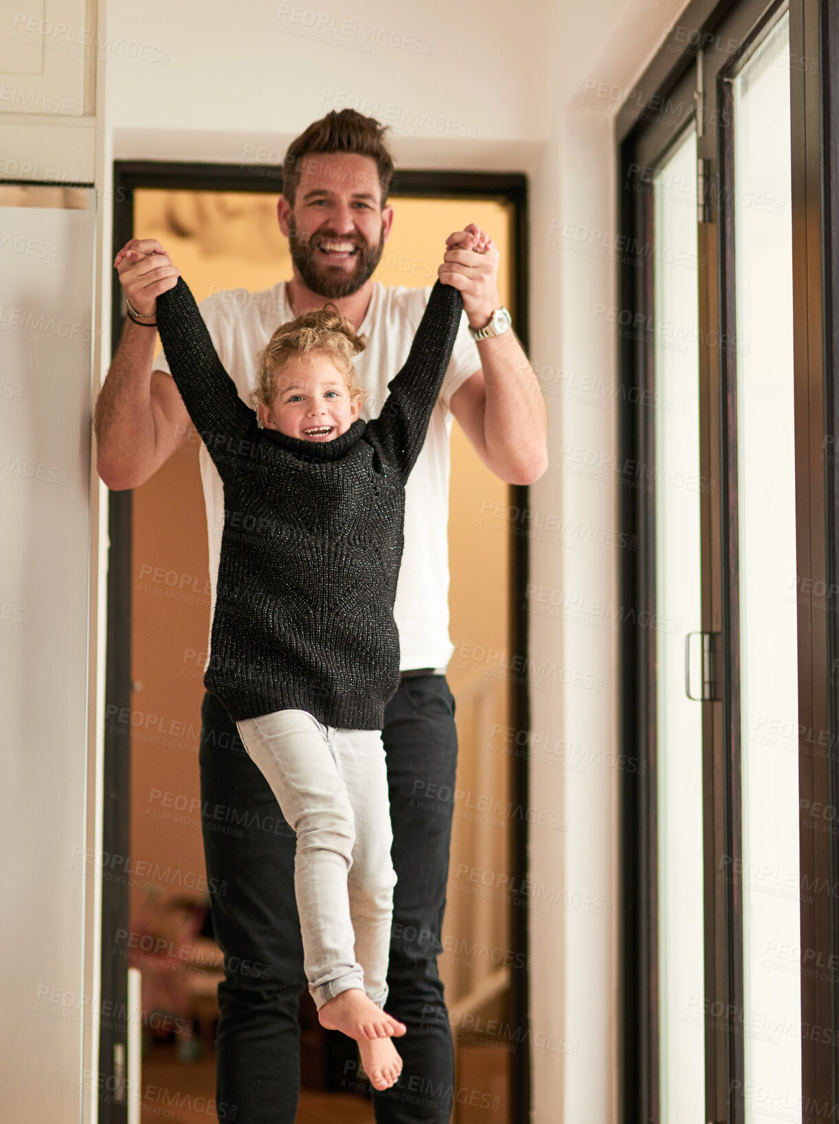 Buy stock photo Home, lift and girl with hands of father for trust, support and bonding together on fathers day. Kid, man and portrait with smile at apartment for playful fun, love and safety in child development