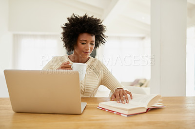 Buy stock photo Woman, laptop and happy in home with book, social media and typing or browse for online shopping or networking. Communication, internet search and reading novel on weekend, relax and apartment table