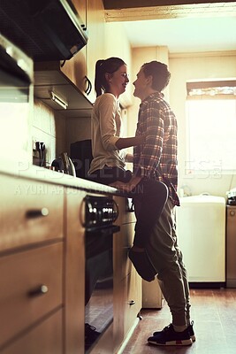 Buy stock photo Smile, love and couple in home kitchen for bonding, connection or healthy relationship in the morning. Romance, happy man and woman together for care, support and marriage commitment in apartment