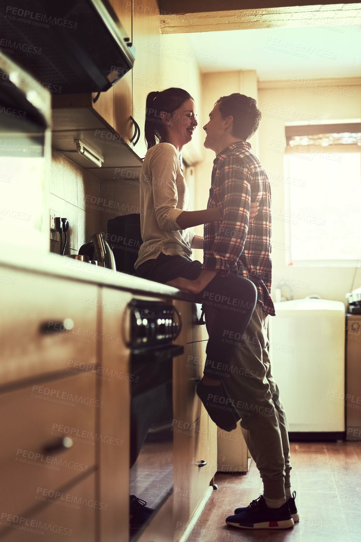 Buy stock photo Smile, love and couple in home kitchen for bonding, connection or healthy relationship in the morning. Romance, happy man and woman together for care, support and marriage commitment in apartment