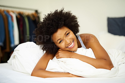 Buy stock photo Black woman, portrait and happy in bed for relax, wellness and self care after sleep in house. Female person, smile and peace with duvet or pillow for wake up, health and bedroom at home on weekend