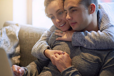 Buy stock photo Couple, hug and relax on sofa at house together in living room with affection, bonding and love on weekend. Smile, man and woman in relationship in lounge streaming on laptop  for entertainment