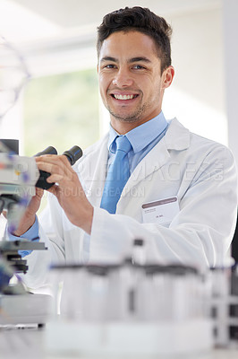 Buy stock photo Scientist, microscope and portrait in lab with smile for research study, medical test or investigation. Happy, man and experiment with biotechnology for vaccine, innovation and stem cell development