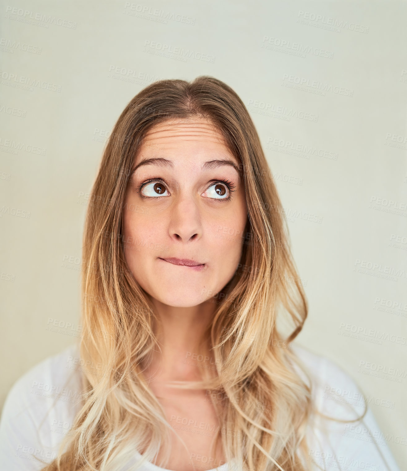 Buy stock photo Face, woman and rolling eyes on portrait in studio background with unsure and uncertain. Female person, isolated and facial expression or feeling for confused, disappointed and thinking for ideas