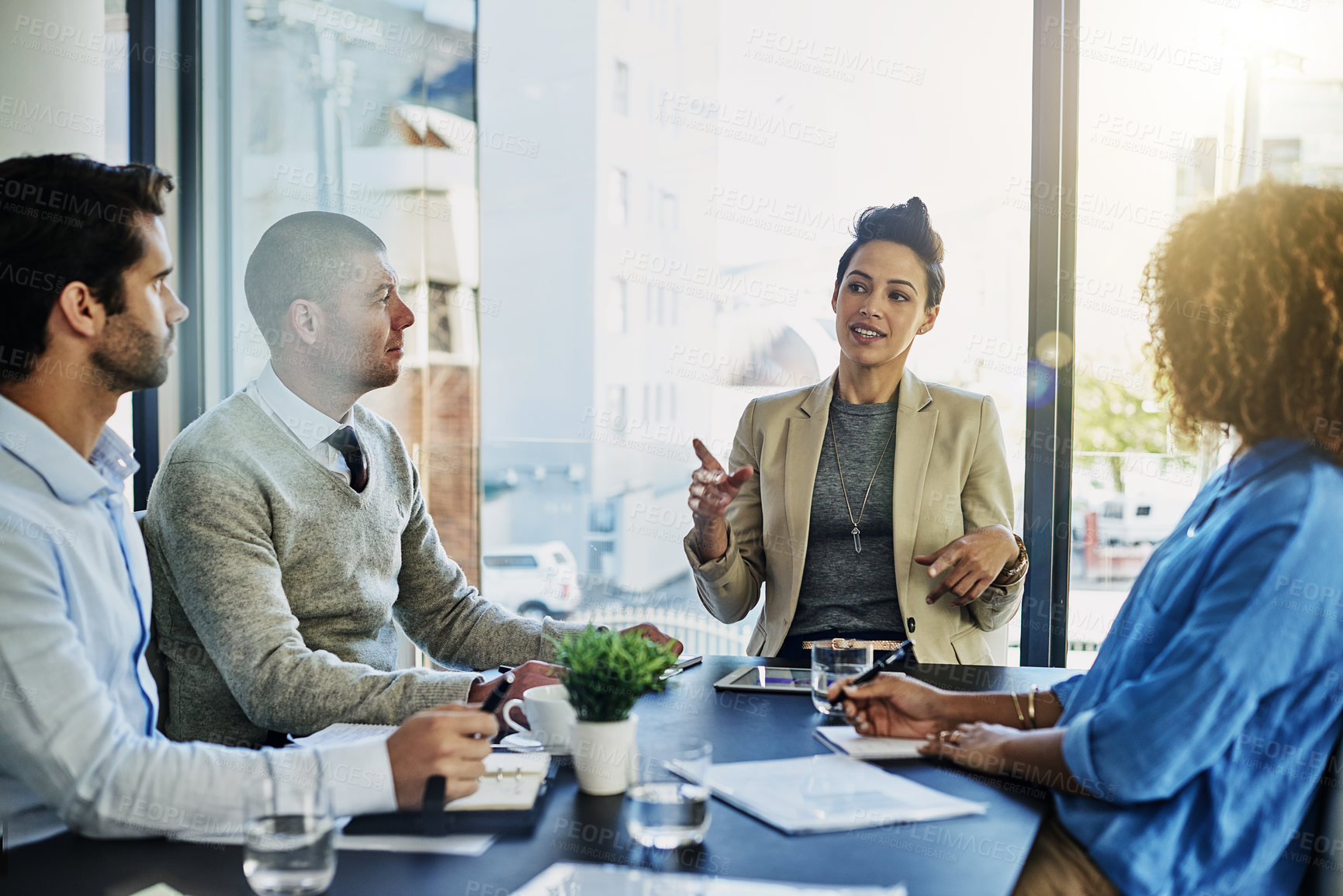 Buy stock photo Business woman, meeting and presentation with team for planning, discussion or conversation at office. Female person or coach talking to group of employees for project or development at workplace