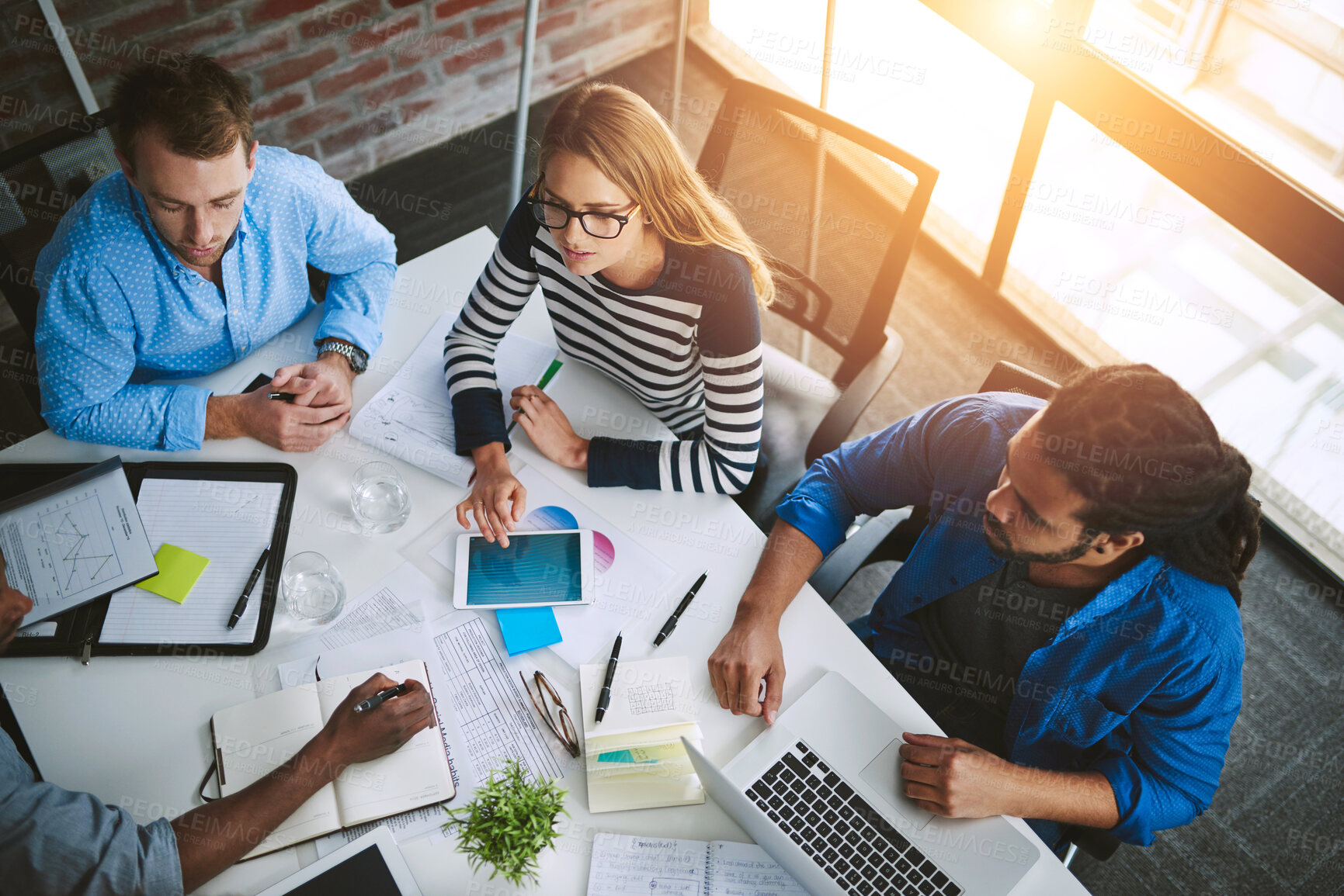 Buy stock photo Meeting, boardroom and teamwork in office with overhead, notebook and lens flare. Planning, strategy and documents for collages and design for creative agency, writing or business people in workplace