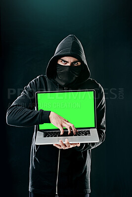 Buy stock photo Man, laptop and portrait on black background for hacking, phishing and malware with green screen. Hacker, technology and software for cyber crime, hacktivism or cryptocurrency thief with mockup space