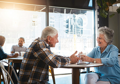 Buy stock photo Senior couple, talking and happy in cafe for date with conversation, drinking tea or communication. Elderly, people and discussion in coffee shop with smile for bonding, retirement or relax with care