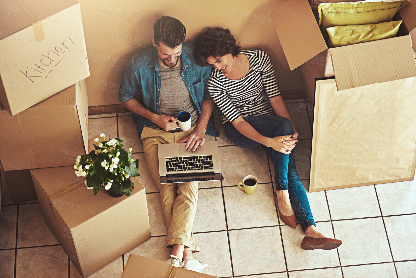 Buy stock photo Box, moving and couple with laptop in new home for property website, real estate plan or remodeling. Coffee, woman and man with technology in high angle for house, investment and renovation idea