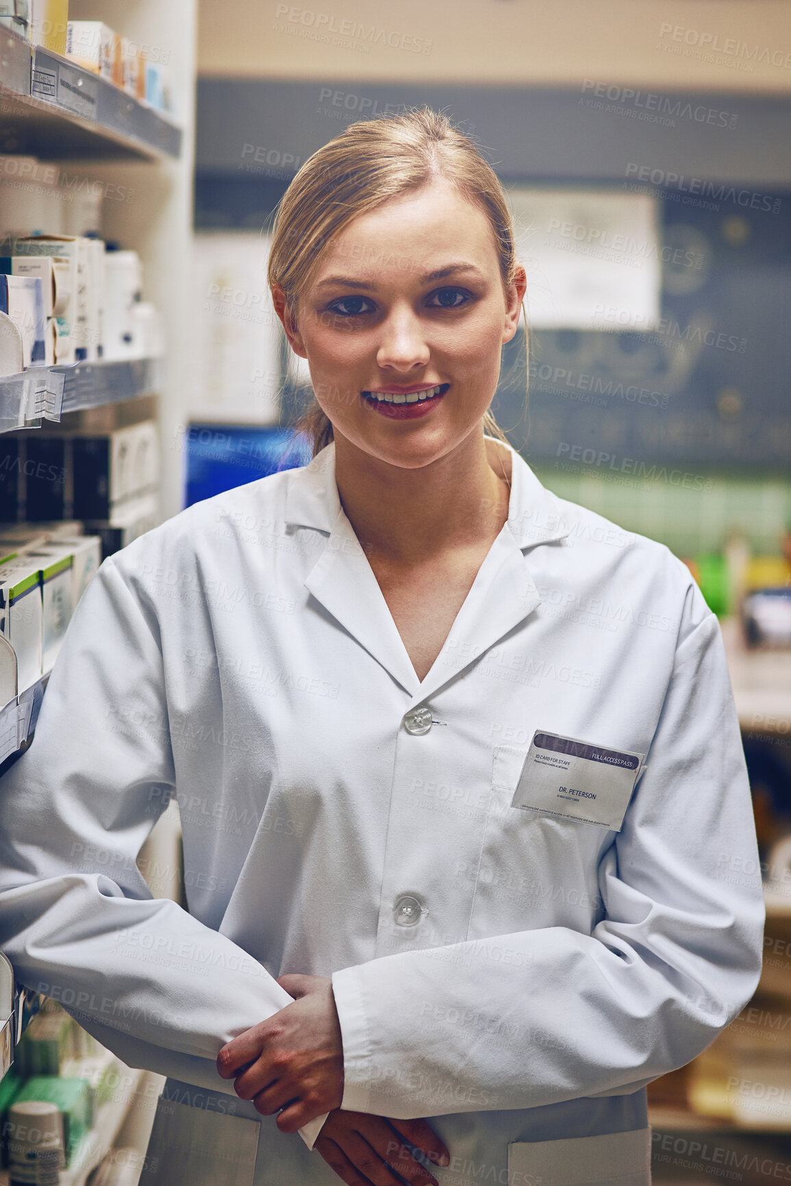 Buy stock photo Shot of an attractive young woman working in a pharmacy