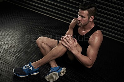 Buy stock photo Knee pain, fitness and man in gym with injury, muscle strain and accident for training, workout and exercise. Sports, health and above of person with inflammation, medical emergency and hurt on floor