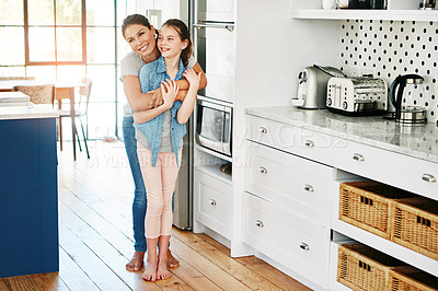 Buy stock photo Happy, mom and girl with embrace in kitchen for connection, care and bonding together on weekend. Family, smile and woman with kid daughter in hug at home for love, support or affection with child