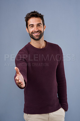 Buy stock photo Happy man, portrait and handshake with greeting for thank you, meeting or introduction on a studio background. Male person or young model with smile for shaking hands, welcome or deal in agreement