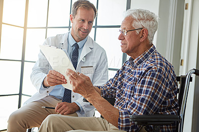 Buy stock photo Doctor, man and wheelchair with paperwork for consultation, report or medical review in hospital. Medic, clipboard and person with disability in clinic for documents, check or rehabilitation for care