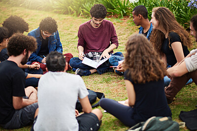 Buy stock photo Cropped shot of a group of college students having a discussion while sitting in a circle outside