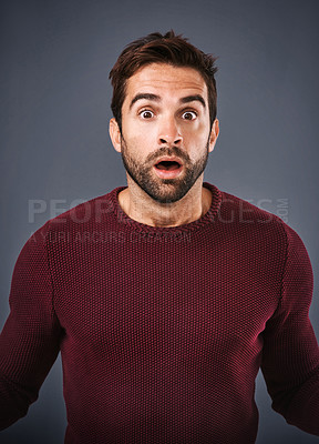 Buy stock photo Studio, surprise and man with rumor, portrait and gossip of discount, wow and news in winter. Gray background, face and person with shock, secret and fear for phobia and scared with sweater or jersey