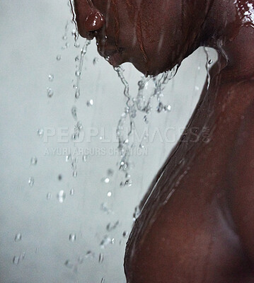 Buy stock photo Black man, water splash and shower with drops for hygiene, grooming or skin hydration on a gray studio background. Closeup of Young African, model or male person with mineral liquid for clean wash