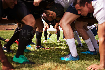 Buy stock photo Shot of a group of young rugby players in a scrum on the field