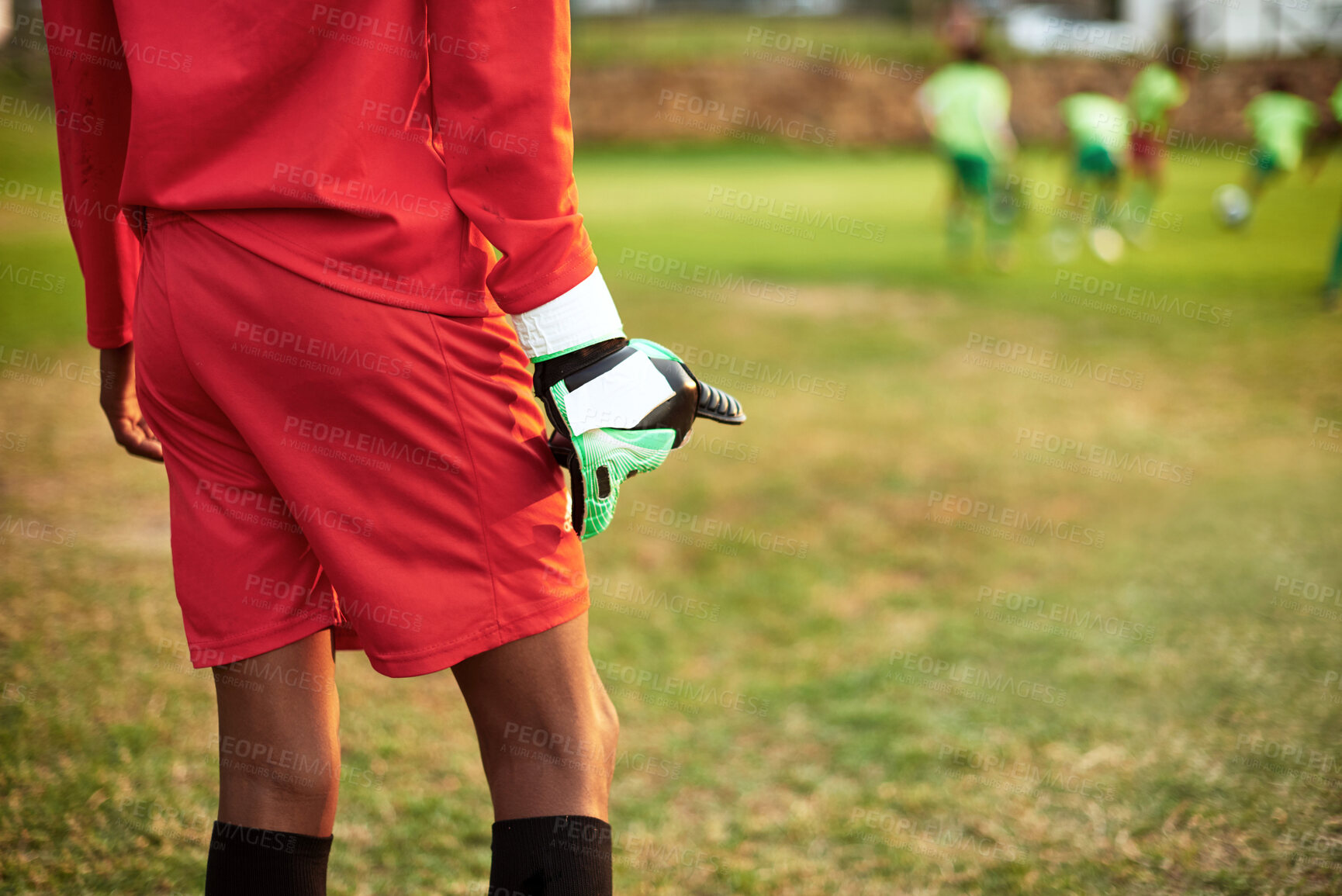 Buy stock photo Closeup shot of a young boy standing as the goalkeeper while playing soccer on a sports field