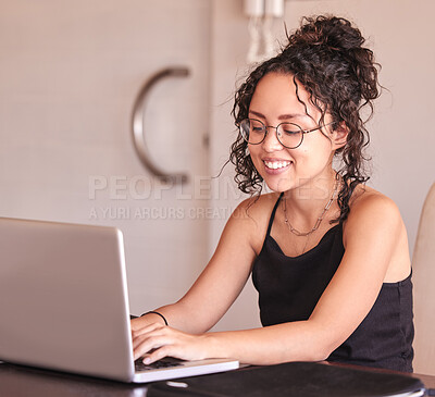 Buy stock photo Happy girl, student and typing with laptop for research, browsing or communication on desk at home. Young writer or female person working on technology for assignment, news or online search at house