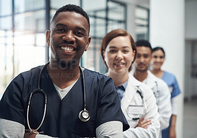 Buy stock photo Doctors, man and arms crossed with smile, team or portrait for diversity in medical career at hospital. Surgeon group, people and women with collaboration, wellness and pride for healthcare services