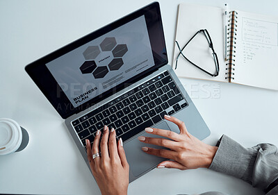 Buy stock photo High angle shot of an unrecognisable businesswoman using a laptop in an office