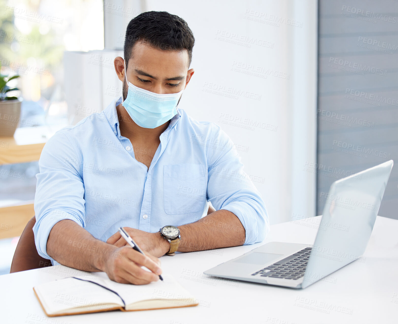 Buy stock photo Businessman, face mask and notebook at desk as corporate professional, safety or financial advisor. Male person, ppe and pandemic virus or hygiene protection as writing for invest, accounting or deal