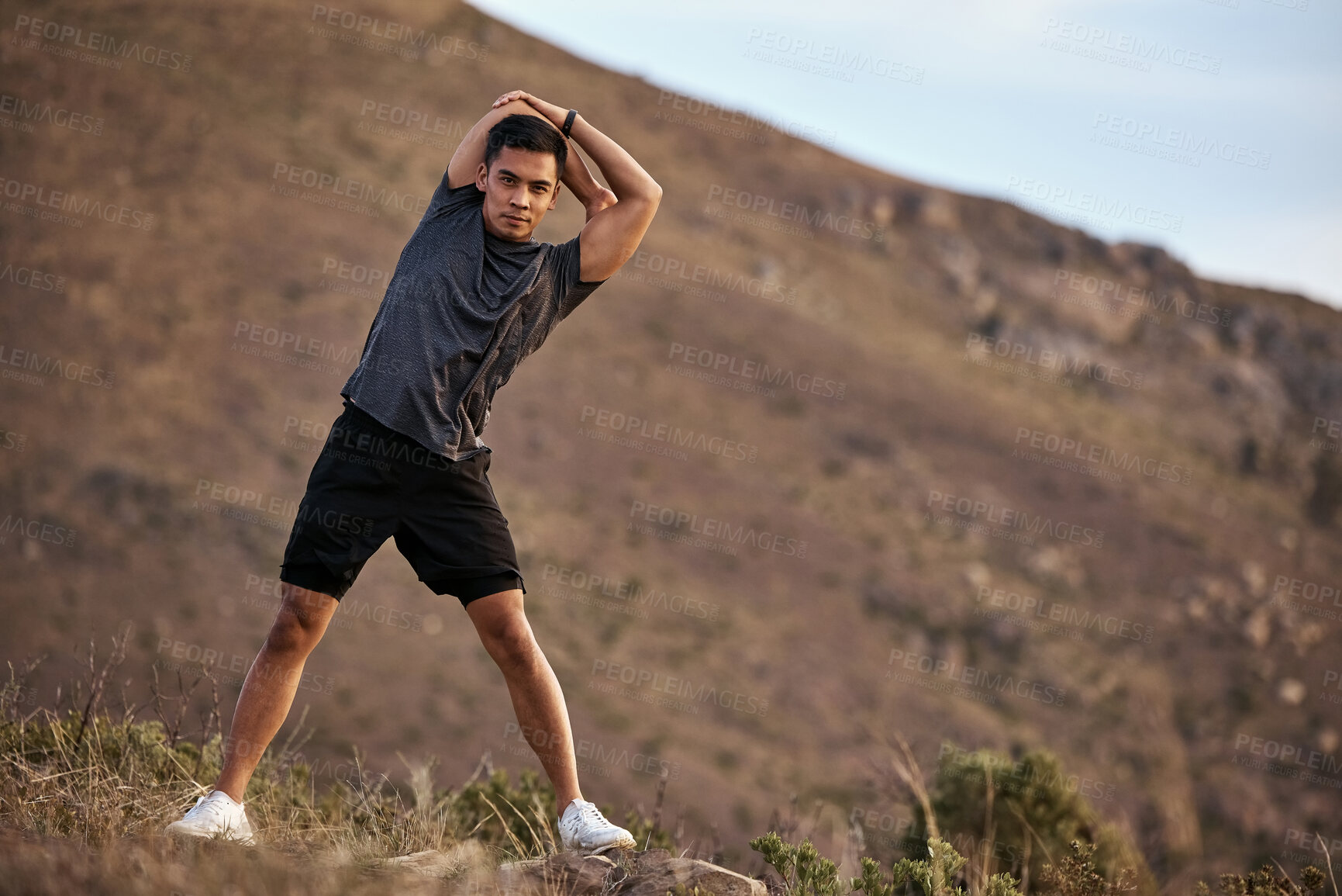 Buy stock photo Athlete, man and fitness on mountain by stretching in portrait for exercise, training and workout for health. Active and male person in Mexico on path for muscles, wellness and calm in nature