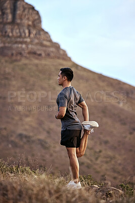 Buy stock photo Athlete, man and fitness on mountain by stretching in outdoors for exercise, training and workout for health. Active and male person in Mexico on path for muscles, wellness and calm in nature
