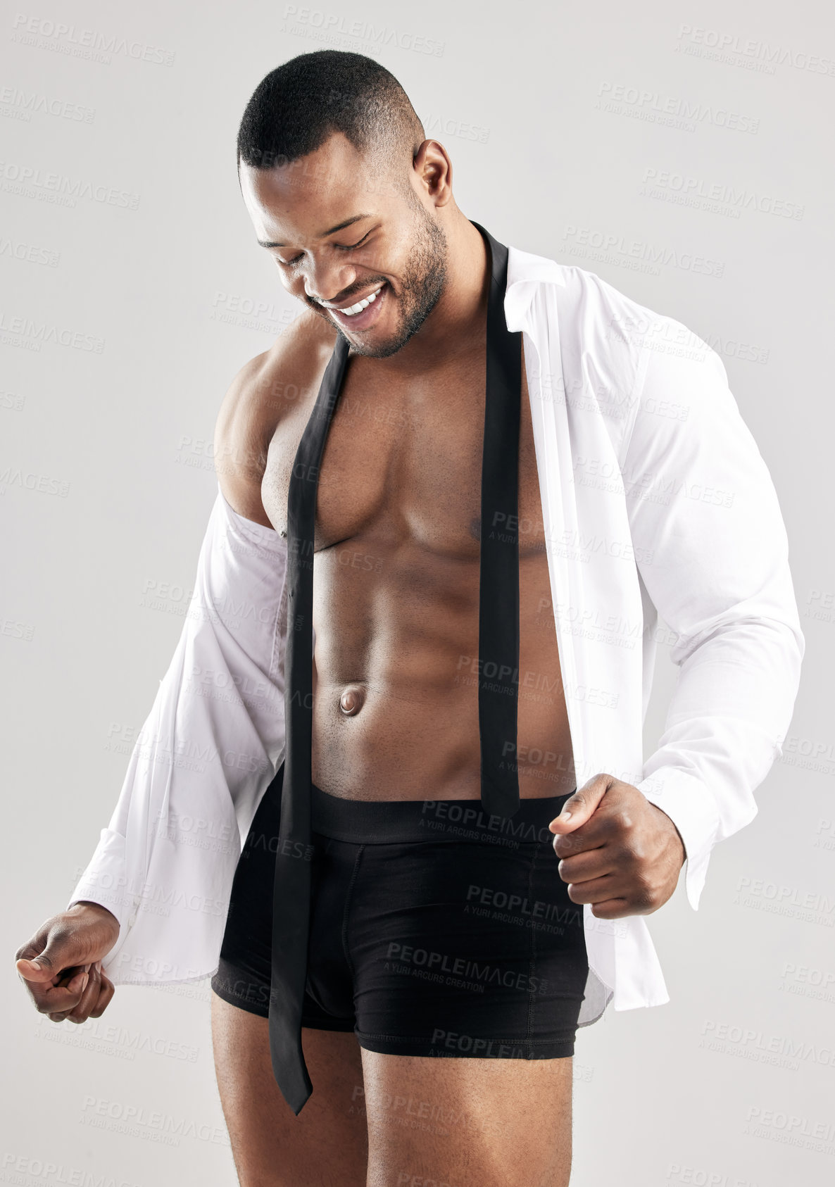 Buy stock photo Studio, black man and smile for fitness, model and muscle in shirt, strong and serious with training. White background, healthy and face of person, bodybuilder and workout for body and underwear