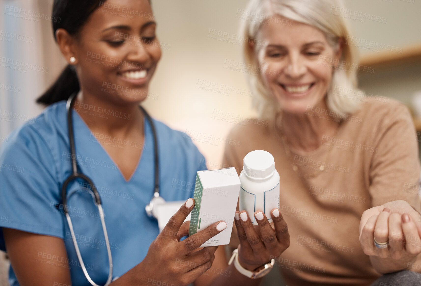 Buy stock photo Shot of a doctor discussing medication options during a a consultation with a senior woman at home