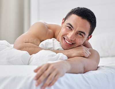 Buy stock photo Shirtless, portrait and man in bedroom, relax and smile on bed, happy and peace in morning. Home, lazy and calm for rest, positive and comfort on mattress, apartment and person in weekend for break