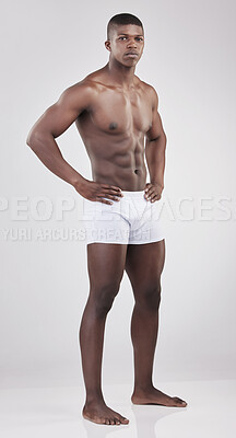 Buy stock photo Black man, healthy and muscle with white background or shirtless with confidence, exercise or strong with stomach. Male person, studio and natural with jeans for fitness, motivation for workout