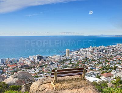 Buy stock photo Scenic landscape banner view of a public bench on a cliff or hill overlooking the city and the ocean. Empty, peaceful, and quiet natural area with a seat for relaxation in nature with copyspace