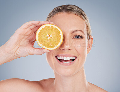 Buy stock photo Skincare, orange fruit and portrait of woman in studio for facial treatment, natural glow or wellness on white background. Smile, beauty and hand of model for vitamin c, eco friendly or dermatology