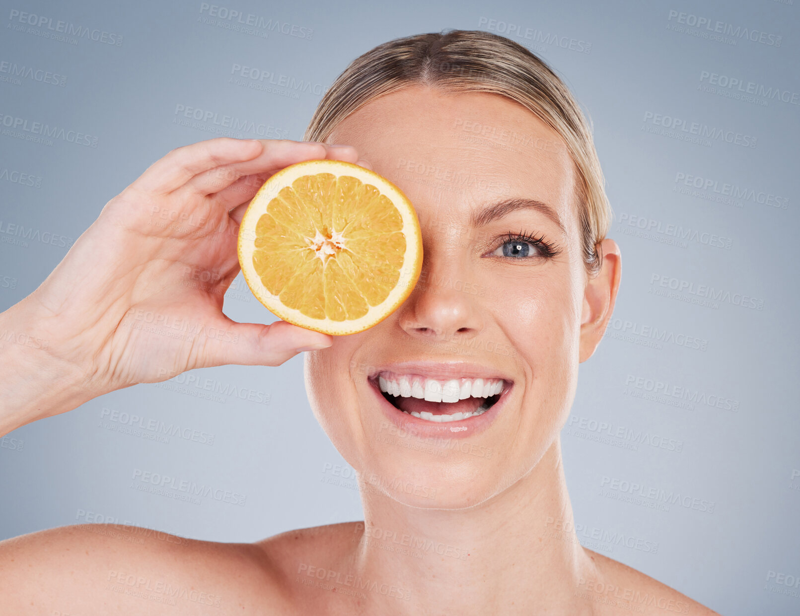 Buy stock photo Skincare, orange fruit and portrait of woman in studio for facial treatment, natural glow or wellness on white background. Smile, beauty and hand of model for vitamin c, eco friendly or dermatology