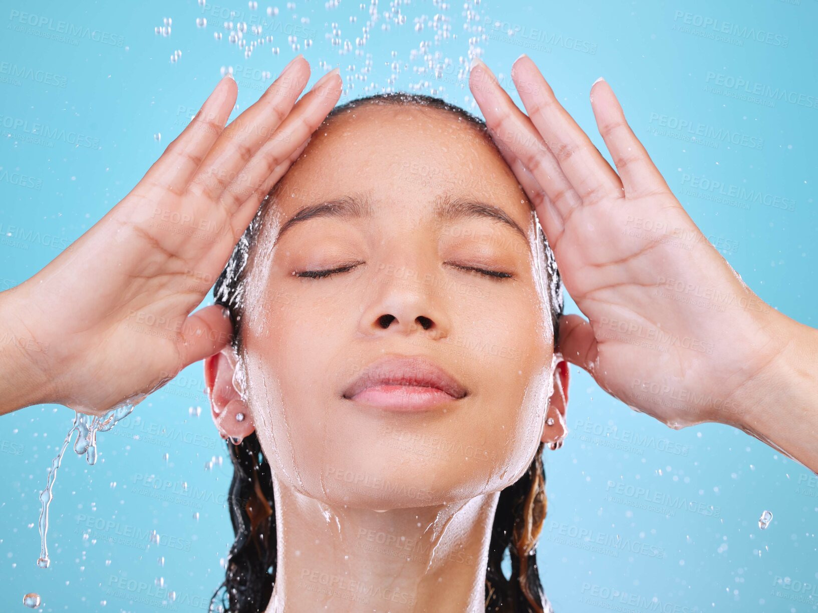 Buy stock photo Woman, shower and eyes closed with hygiene in studio with routine, change and health with ideas by blue background. Person, model and cleaning with hair care, water drops and wellness with reflection