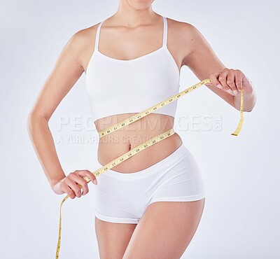 Buy stock photo Hands, underwear and woman with tape measure on stomach for diet, nutrition or natural body. Weight loss, abdomen and slim model check skin for health and wellness isolated on white studio background