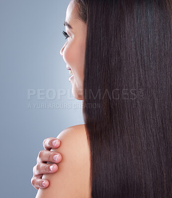 Buy stock photo Close up, woman and hair care in studio from back, keratin treatment and shoulder on blue background. Happy, straight and female person with hand for luxury, salon therapy and healthy or wellness