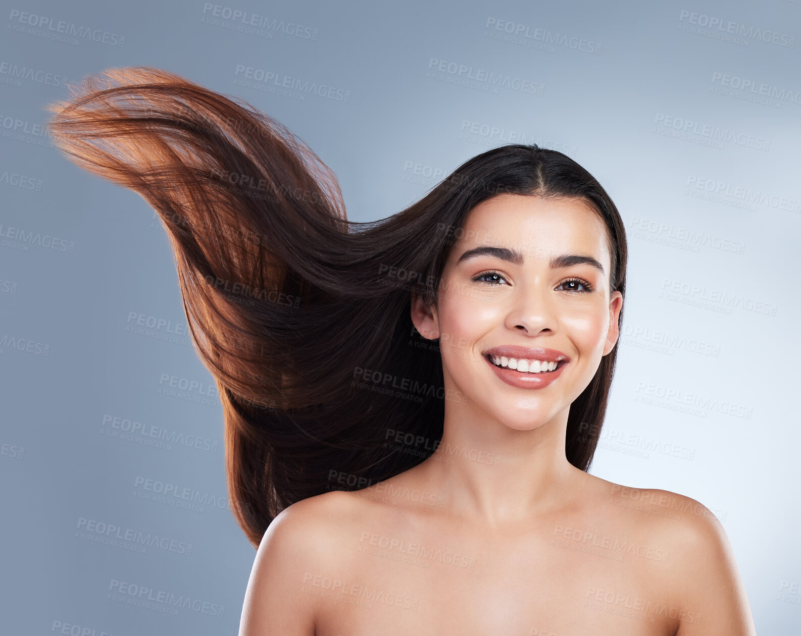 Buy stock photo Smile, wind and portrait of woman with hair care in studio with natural, beauty and salon treatment. Happy, health and female person with shampoo shine for silky hairstyle isolated by gray background