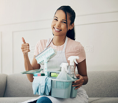 Buy stock photo Thumbs up, portrait of a woman with cleaning supplies in basket and in living room of her home for success. Good service or motivation, hygiene and female person with hand gesture for clean house