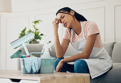 Buy stock photo Tired, exhausted and woman cleaning a house  with supplies, chemical or tools. Young female or cleaner in a clean lounge with headache or stress at an apartment or room with fatigue or problem