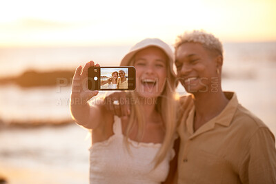 Buy stock photo Beach, couple and phone screen selfie for love, trust or fun while bonding in nature together. Travel, smile and gen z people hug with sunset date for romantic, photography or ocean profile picture